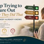 Cover image for the blog post “Stop Trying to Figure Out Why They Did That (Your Body Already Knows)” featuring elegant serif typography beside a reflective woman holding a coffee mug and looking toward a three-color signpost labeled Green, Yellow, and Red. The signs symbolize relationship trust levels: Green “leaves you more,” Yellow “keeps you guessing,” and Red “leaves you smaller.” Warm, calming tones, soft natural lighting, and Samantha Lubin (Binstock) branding create a thoughtful, emotionally grounded self-trust and relationship psychology aesthetic.